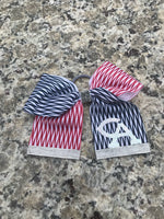 This is a unique patterened Columbia Academy blue and red design and silver glitter 3 inch Cheer bow