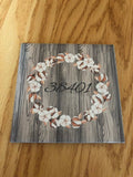 One tile coaster with a 38401 zip code wood grain cotton ring monogram like wood look background.