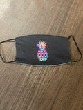 multi colored pineapple designed Face cover, with a black background and black backing and back ear loops face mask