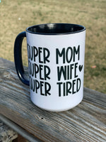 Super Mom, Super Wife, Super Tired design 15 oz. Mug with orange inside and black handle