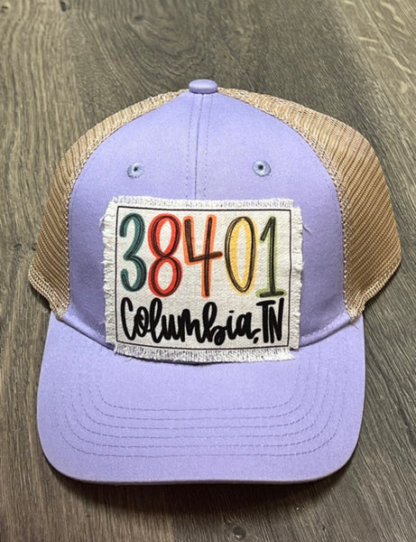 Multi colored 38401 Columbia  designed patch / beige and lavender ponytail hat
