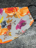 Fall colored flowers and leaves design Face Cover