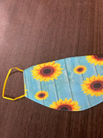 Sunflower Designed Blue Background with a yellow back and yellow ear loops Face Cover